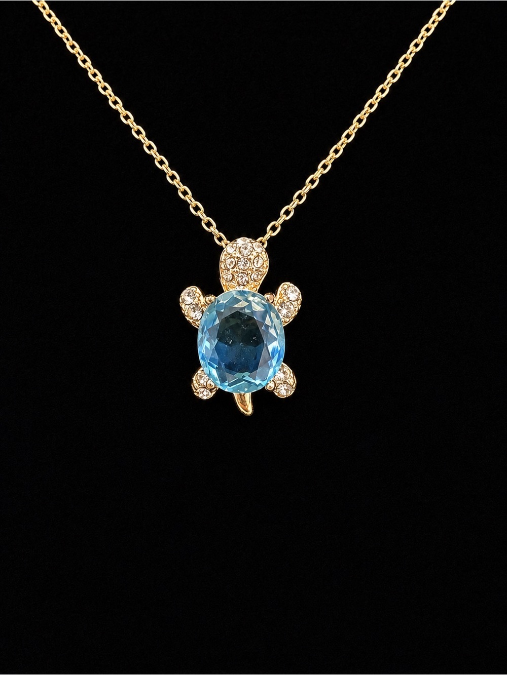 Gold Turtle Necklace with Blue Gem